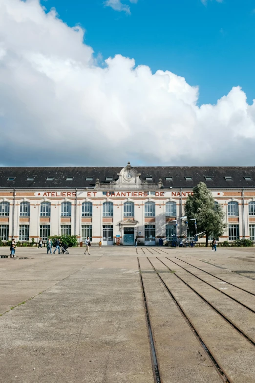 a train tracks that are in front of a building