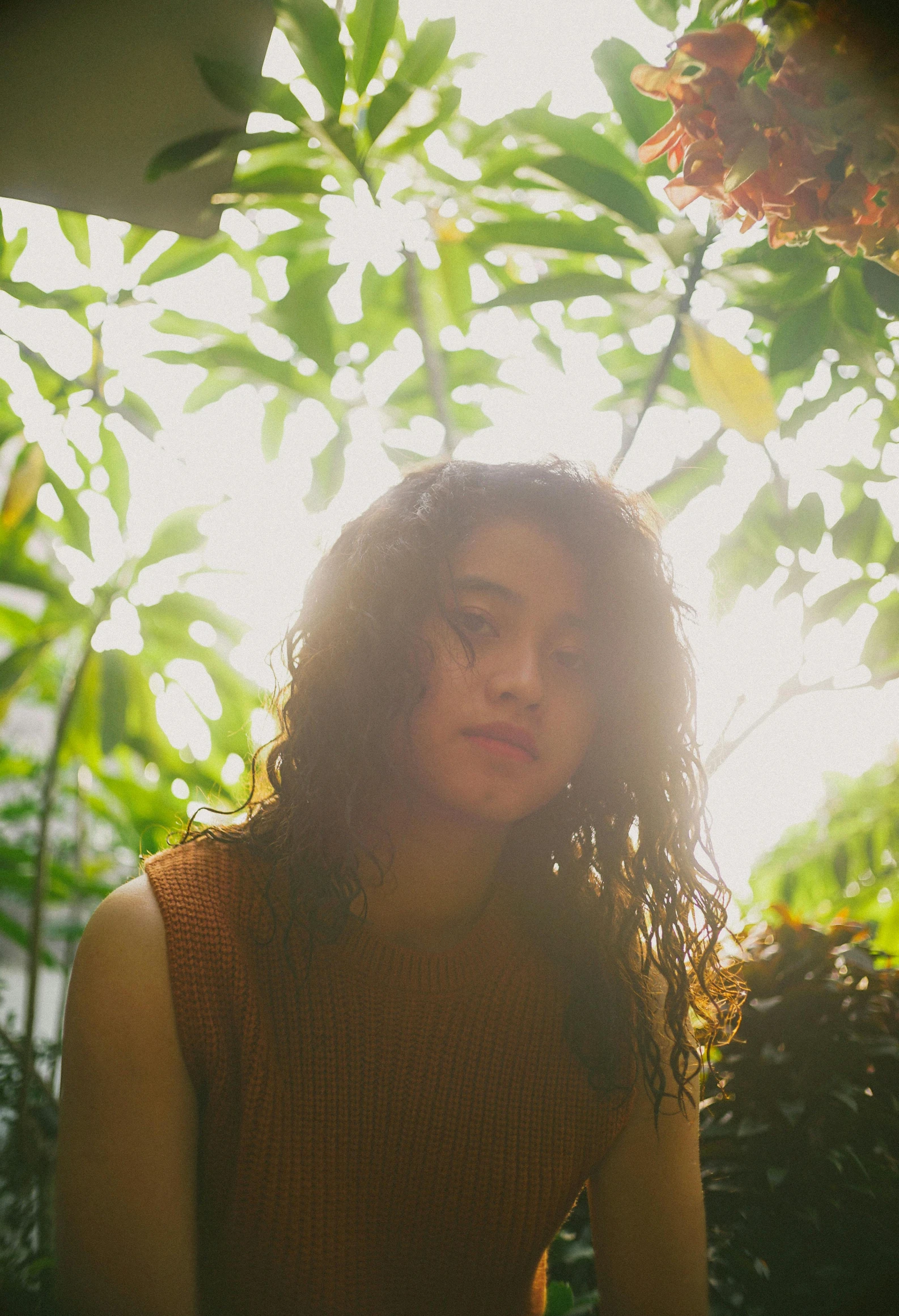 a women who is posing in the sun