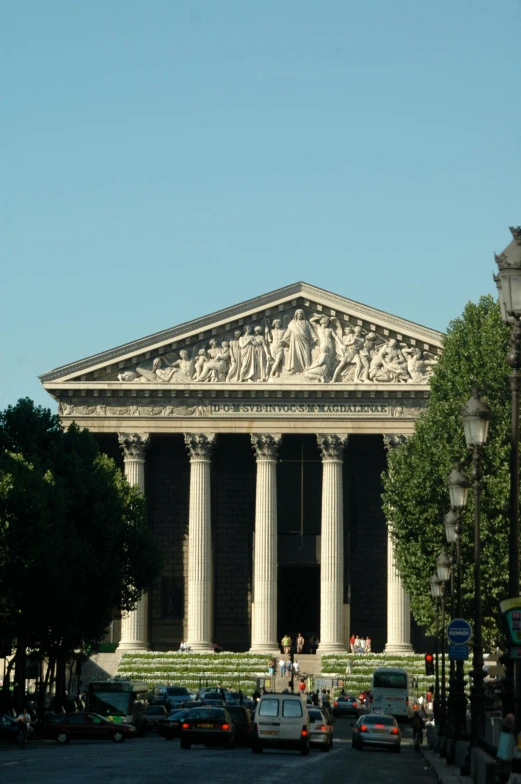 a large stone building that is on the corner of a street