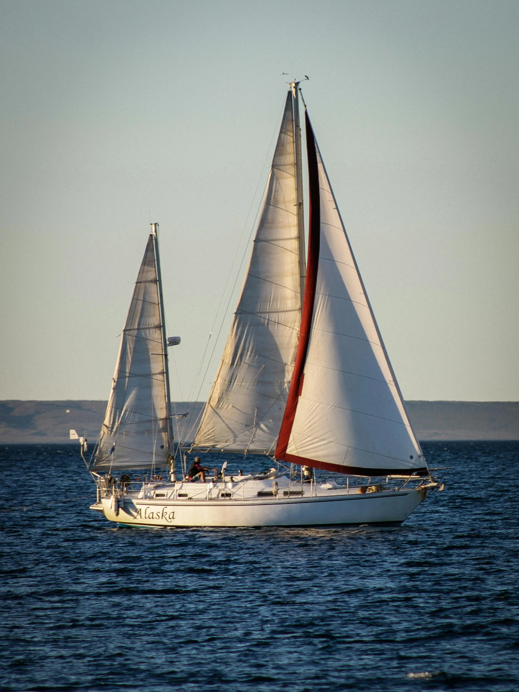 a couple of boats floating in the ocean