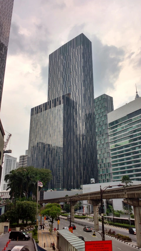 a very tall building that is on a street