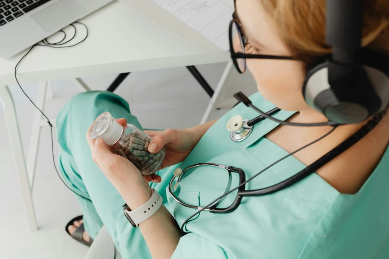 the woman is sitting at the desk with her medical instrument