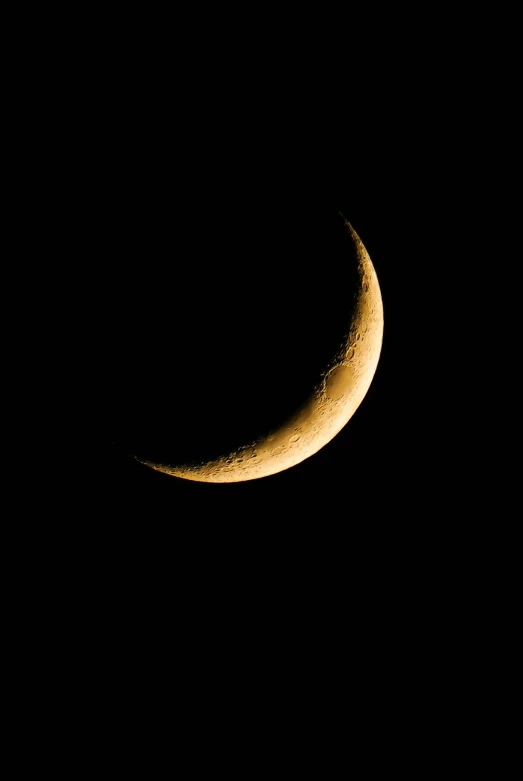 the crescent moon is setting in the night sky