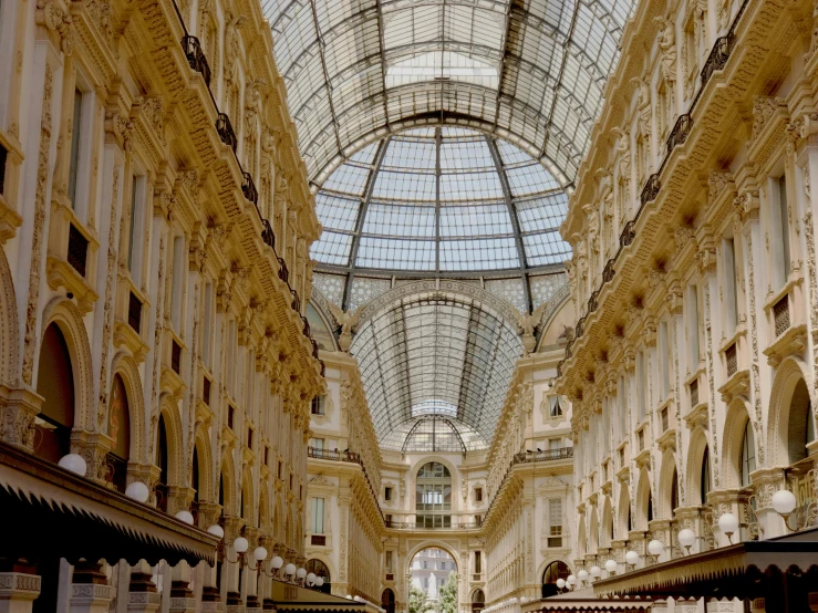 the inside view of a very large building with a glass roof