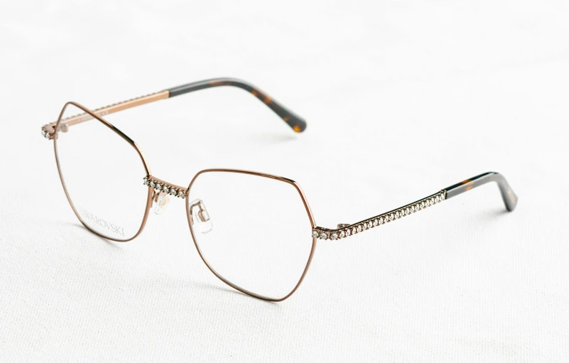 an old pair of glasses is shown on a white background