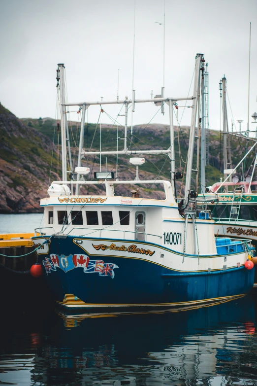 a boat is docked at a dock in the water