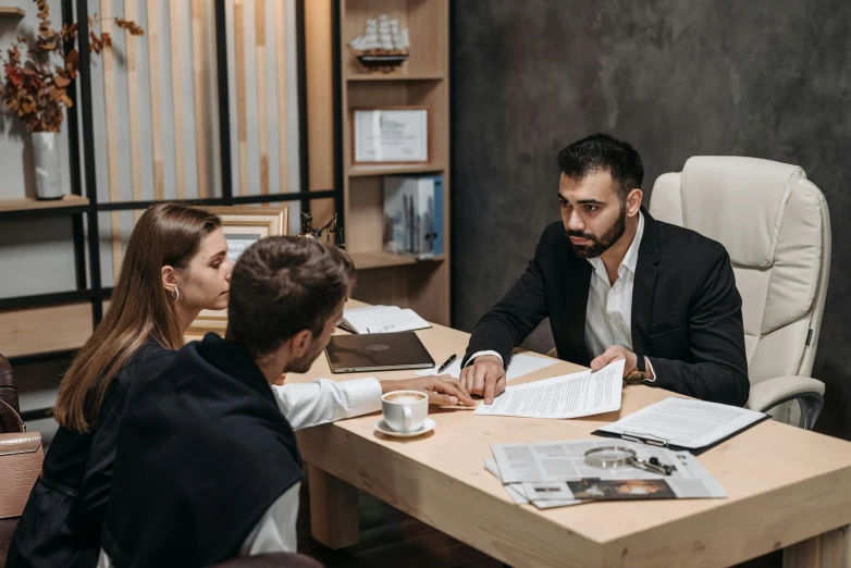 two people in a business meeting sitting at a table