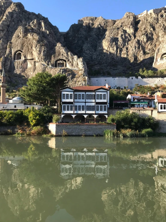 a reflection in the water of an old town