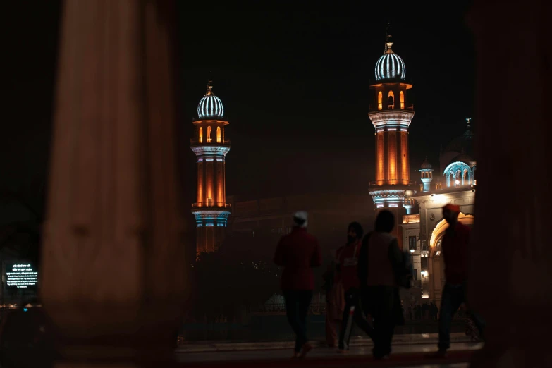 people walking in front of the clock tower