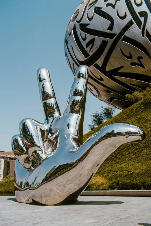 a large sculpture of a person is leaning on it