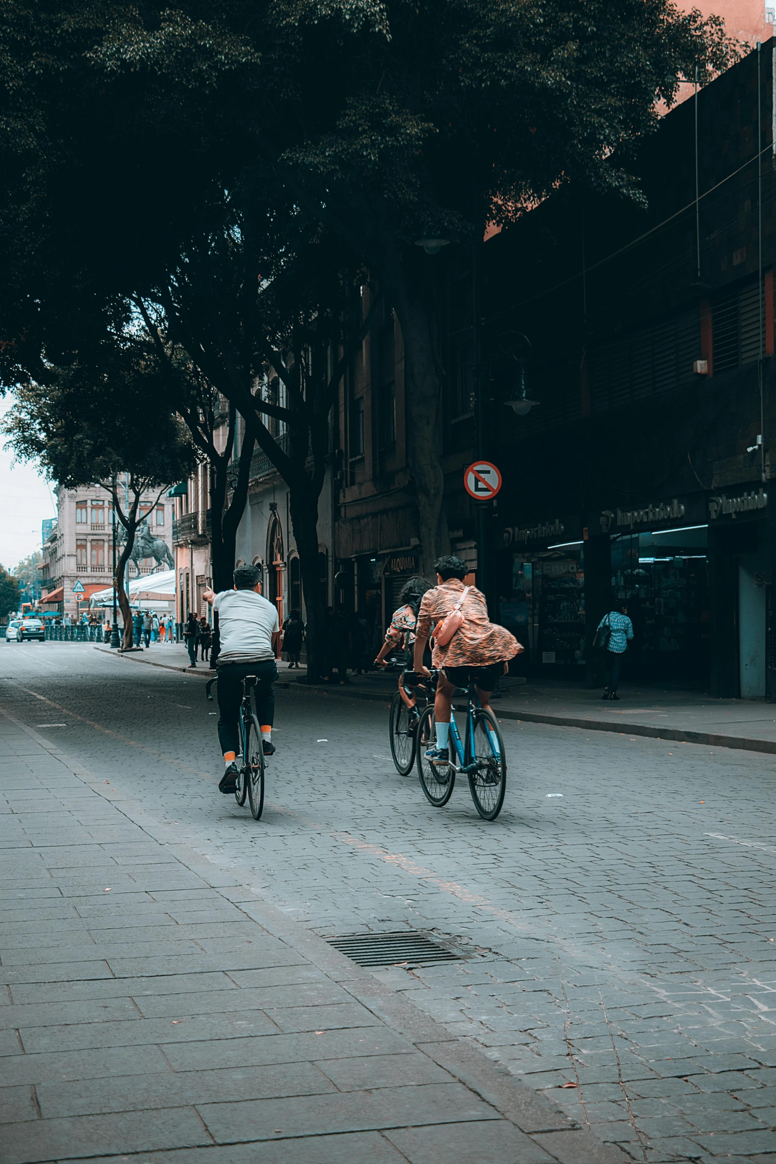 people riding on bikes in a city area