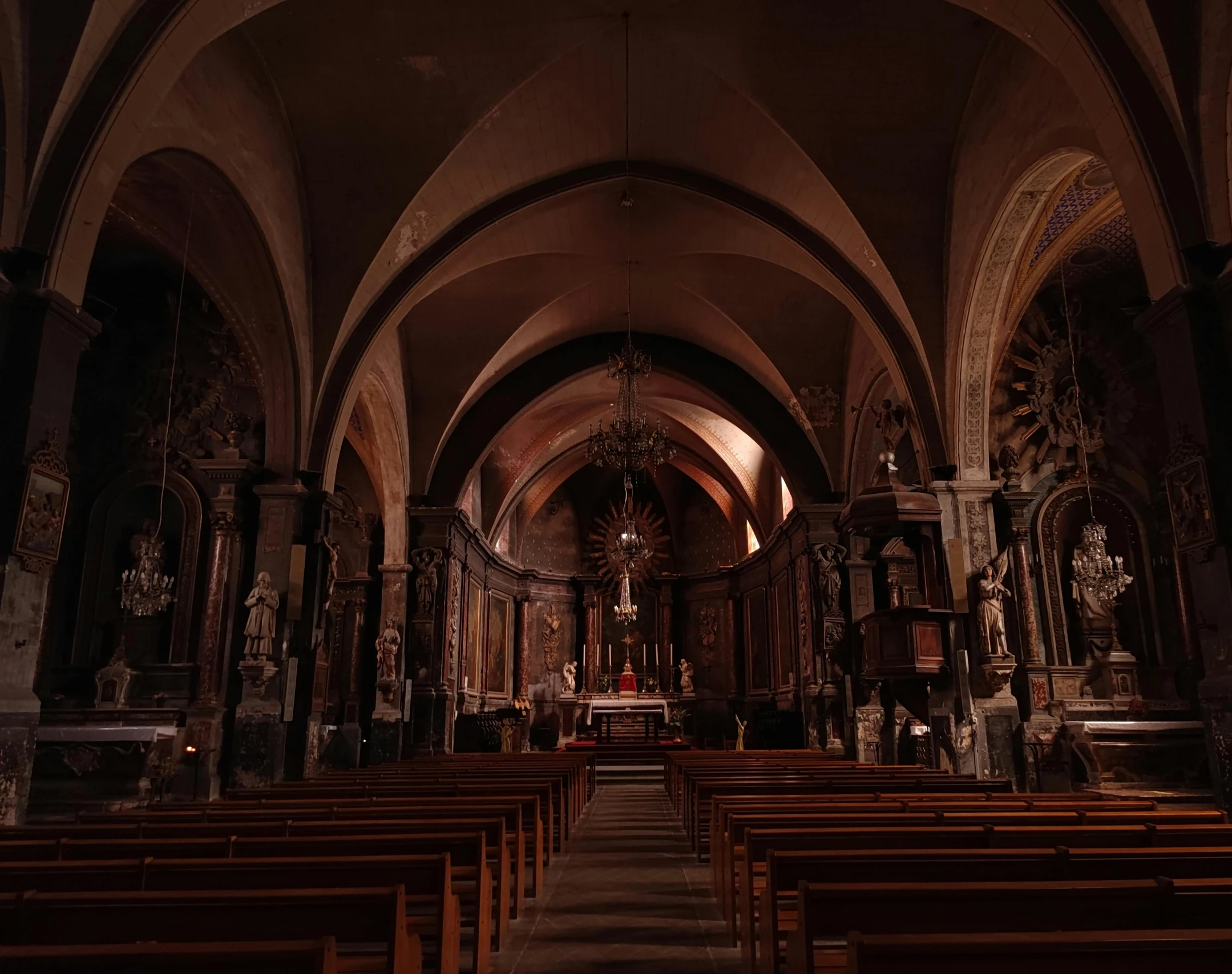 a cathedral with no people in it or is filled with pews