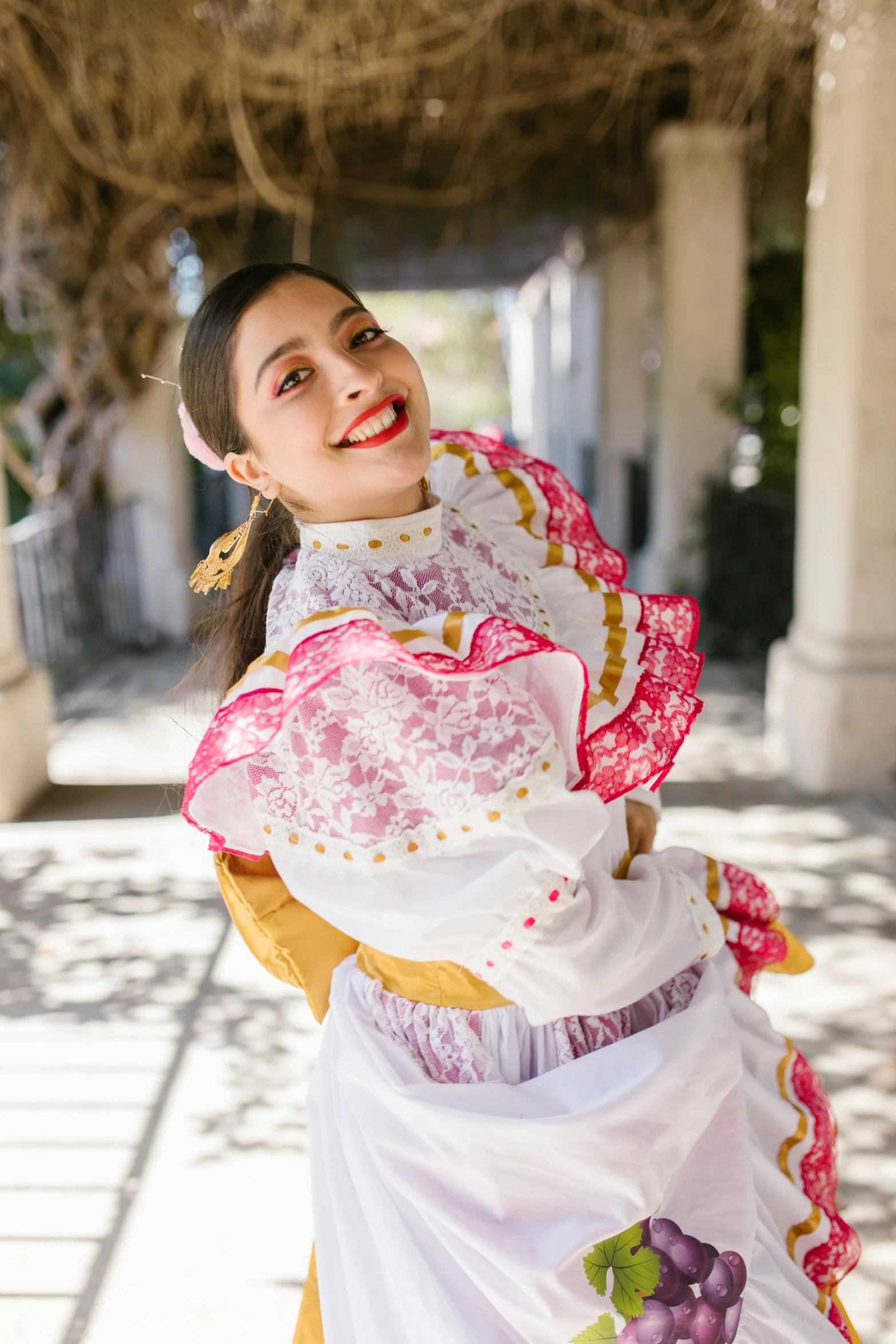 a woman in an elaborate white and pink dress