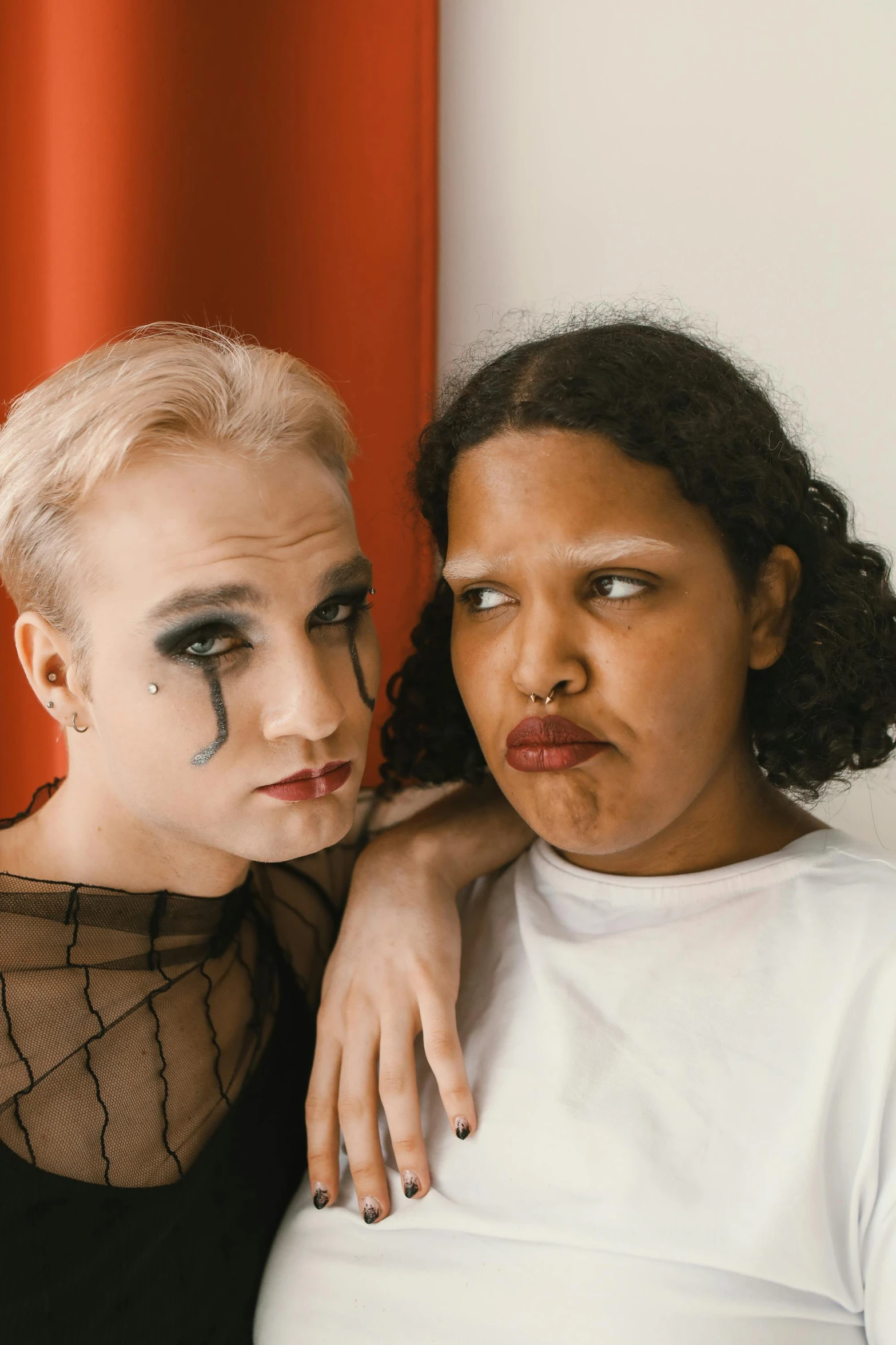 two women posing for a po with fake makeup