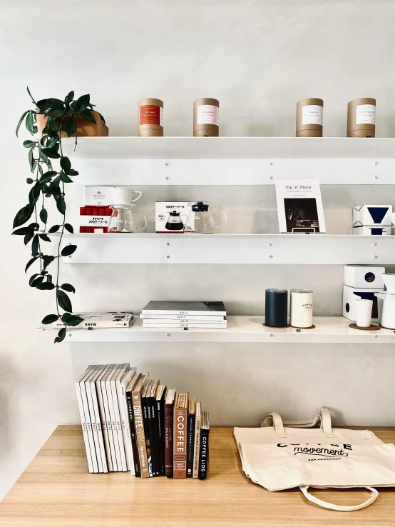 some shelves filled with books and mugs