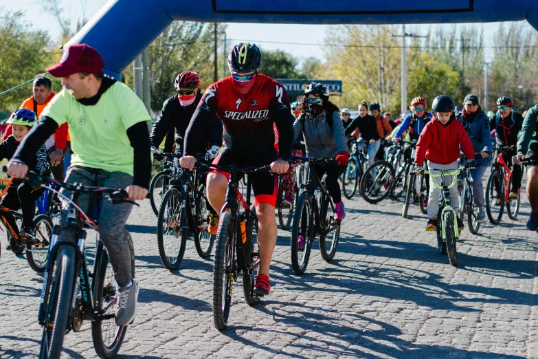 several people are riding bikes in a race