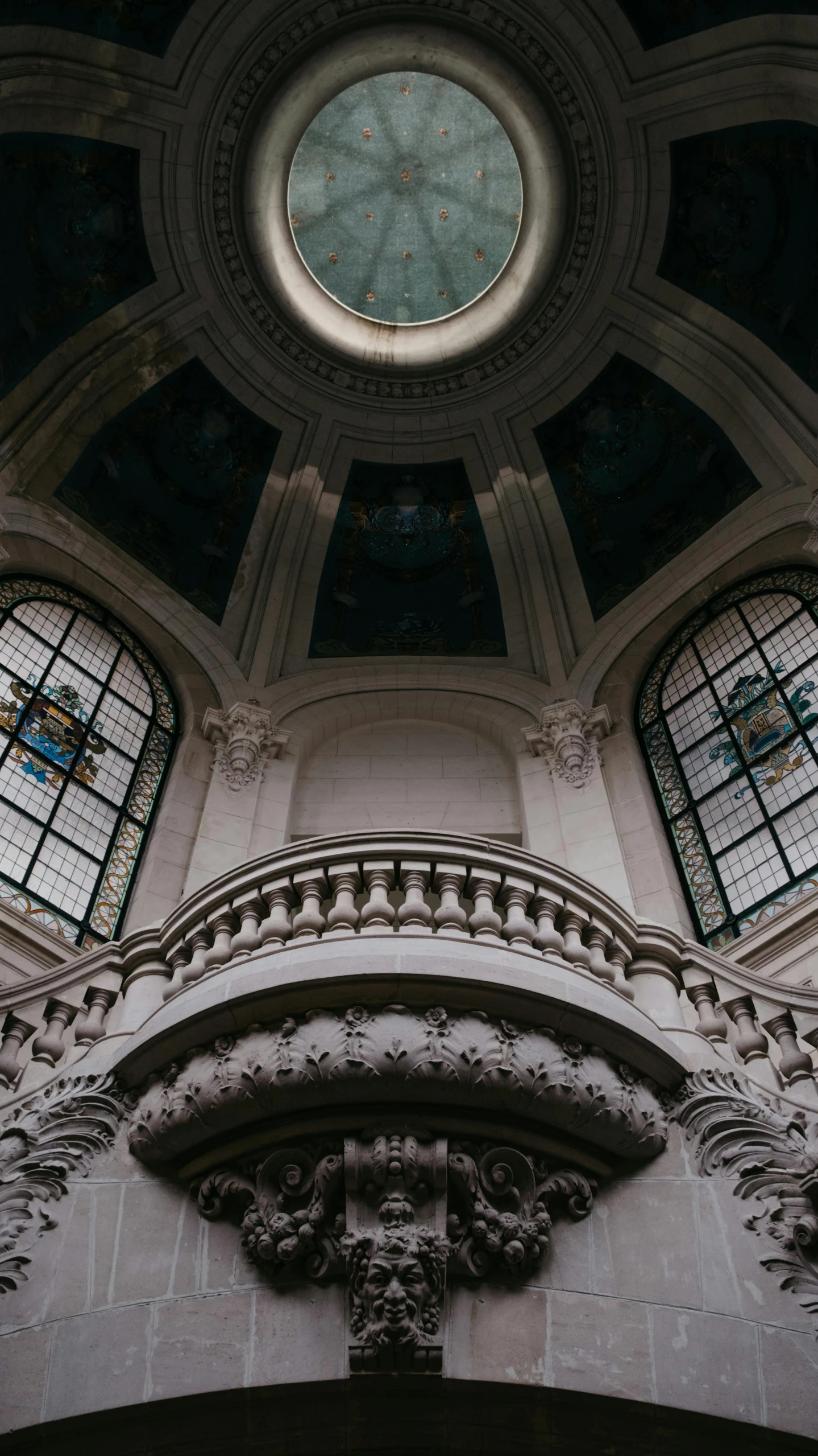 large window in the middle of a very tall building