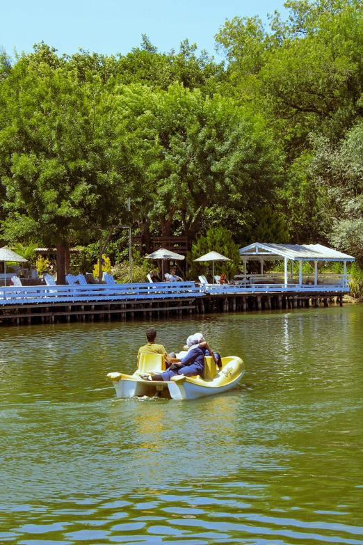 a kayak with several people sitting in the canoes