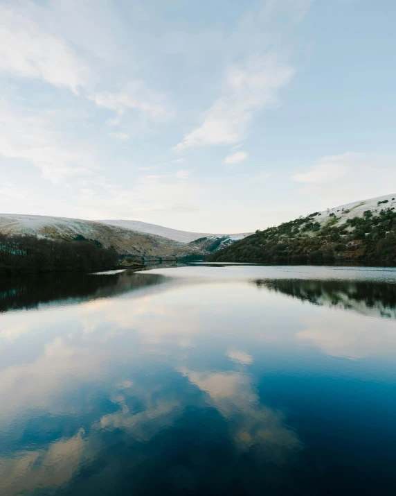 a po of water and land in the background