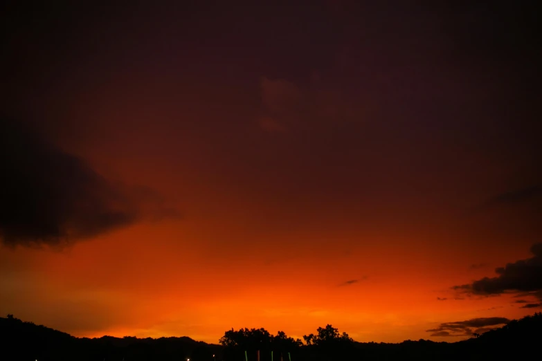 clouds are shining bright against the night sky