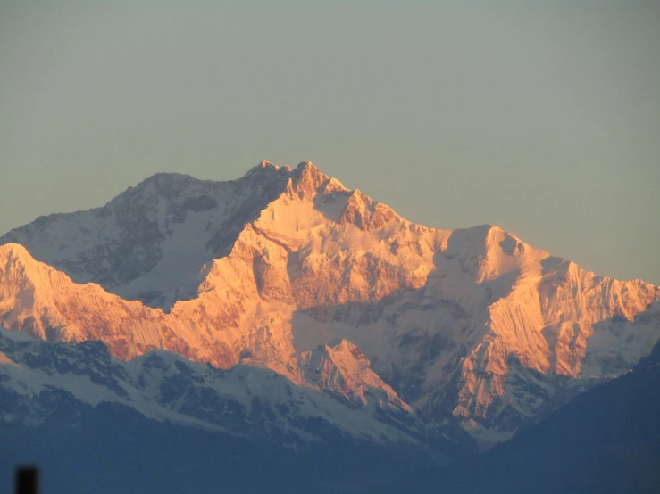 a large snowy mountain peak that has snow on it