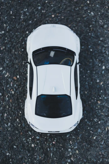 an overhead view of a white sports car