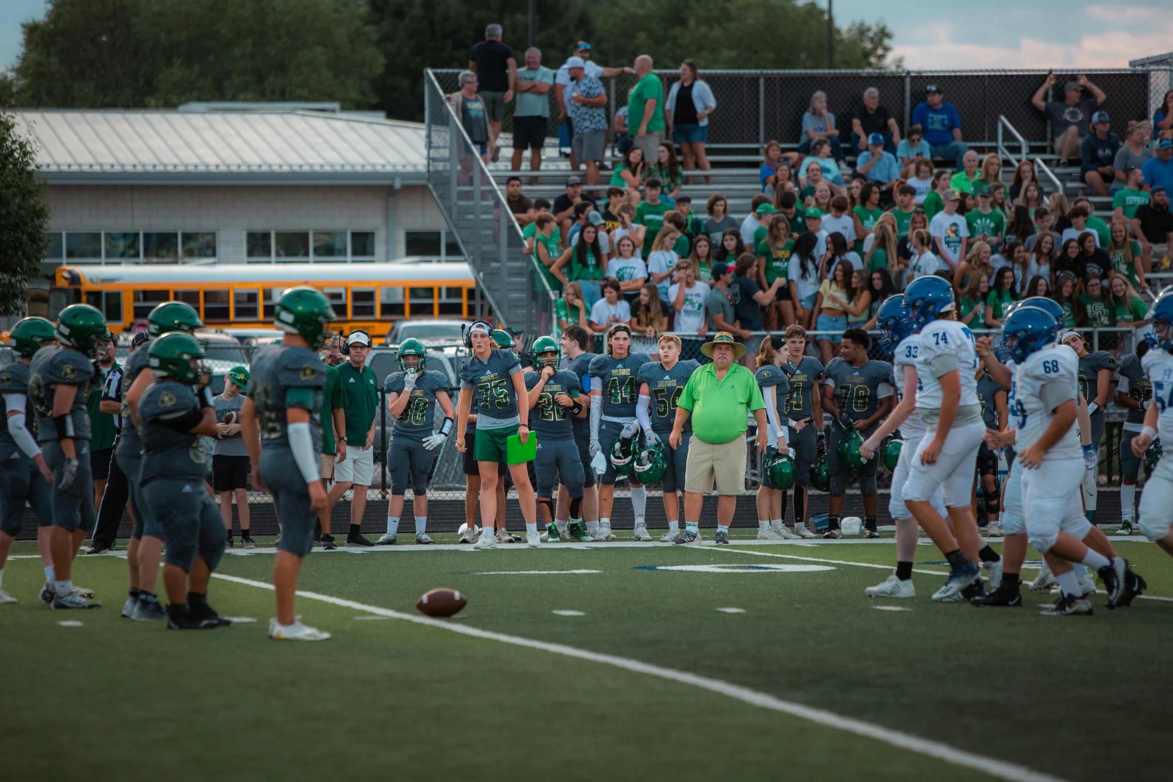 group of men in uniforms on a football field