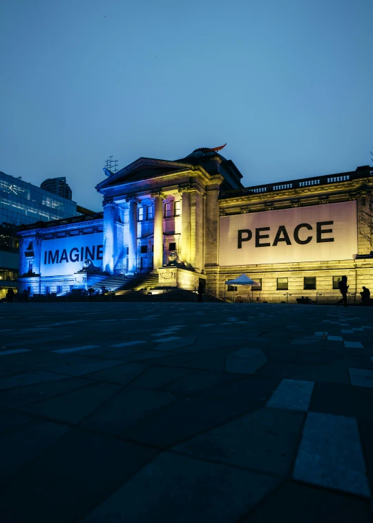 a large building with words projected in the windows