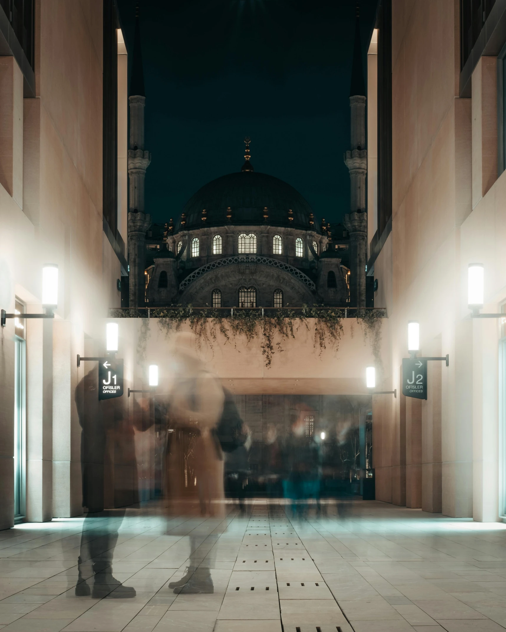 an abstract po of a building and two people in the middle