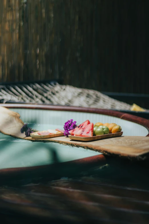 a person with their foot resting in the air next to a bowl of food