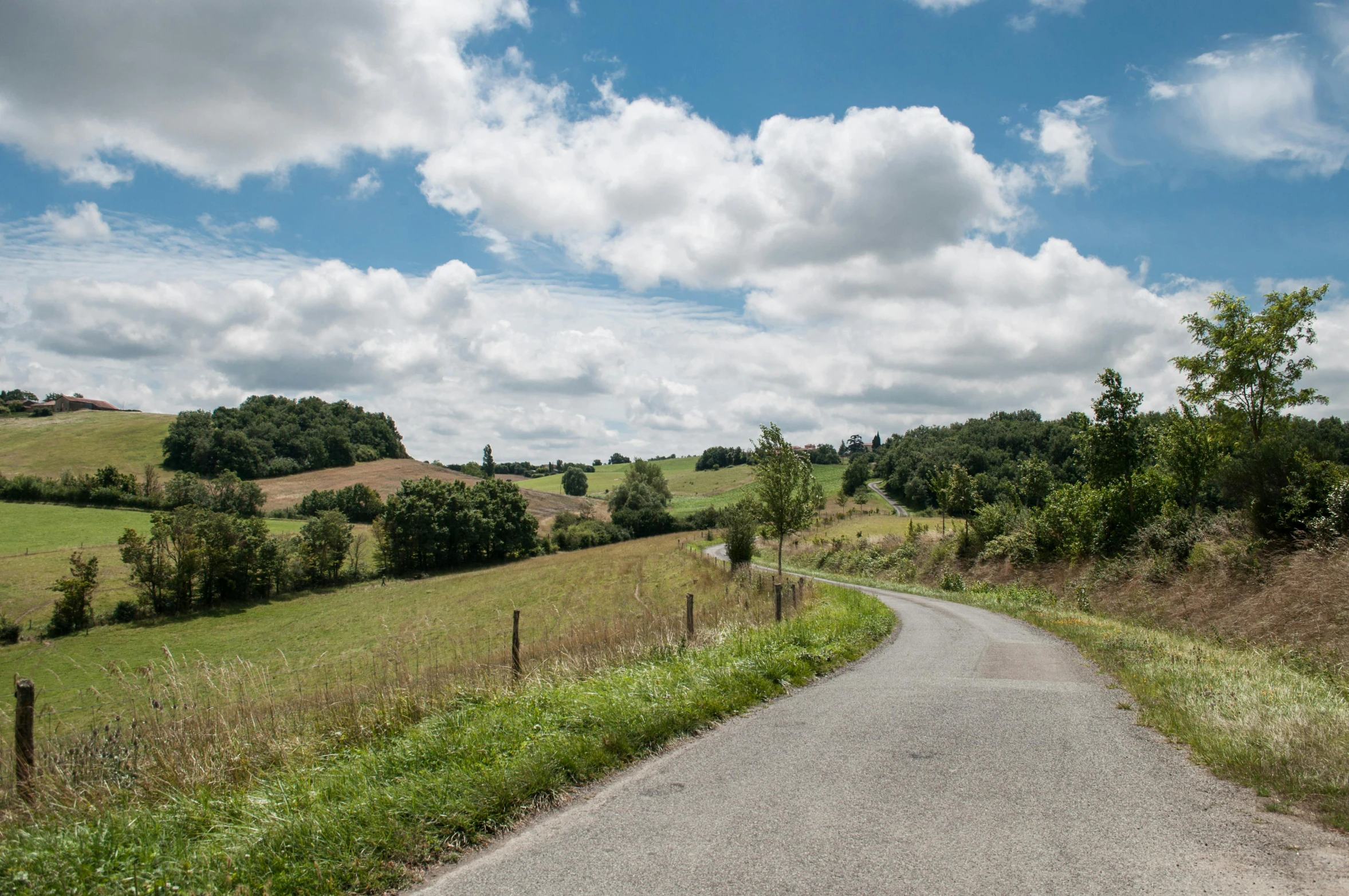 a view of a country road from the road