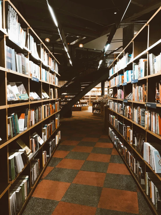 long rows of books on shelves in a liry