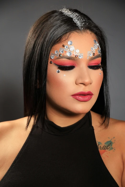 woman with black hair and bright red eye makeup