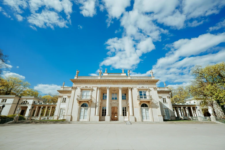 a large white building has many windows