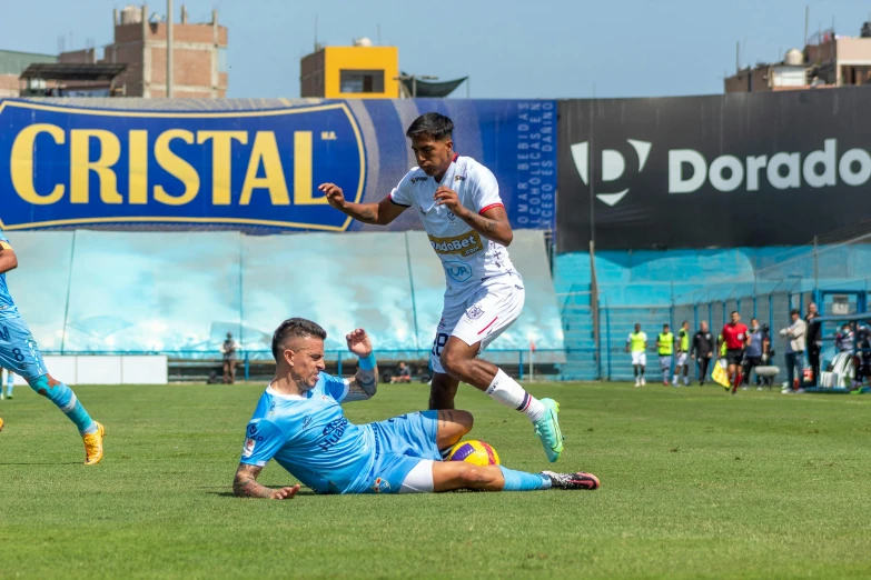 the men are playing soccer on the field