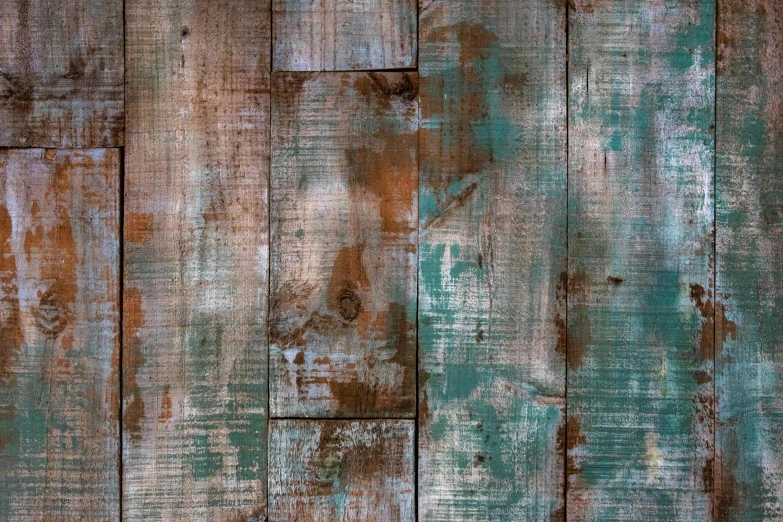 old wood that has been painted green with rust