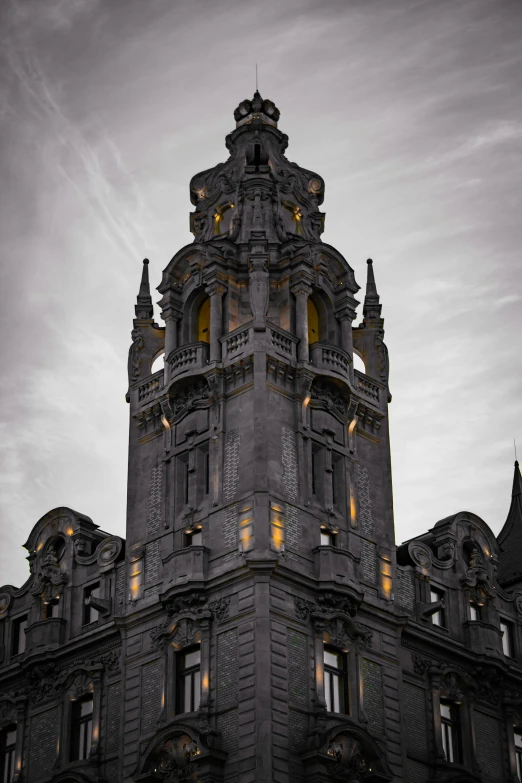 a clock tower with some lights on it