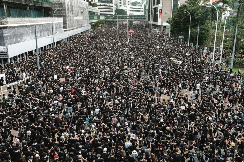 people are standing together in the city for an event