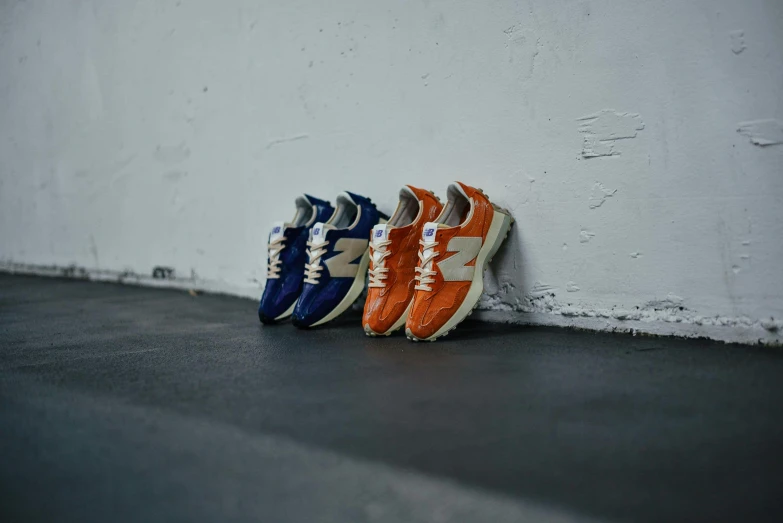 a row of multicolored sneakers sitting on top of a floor
