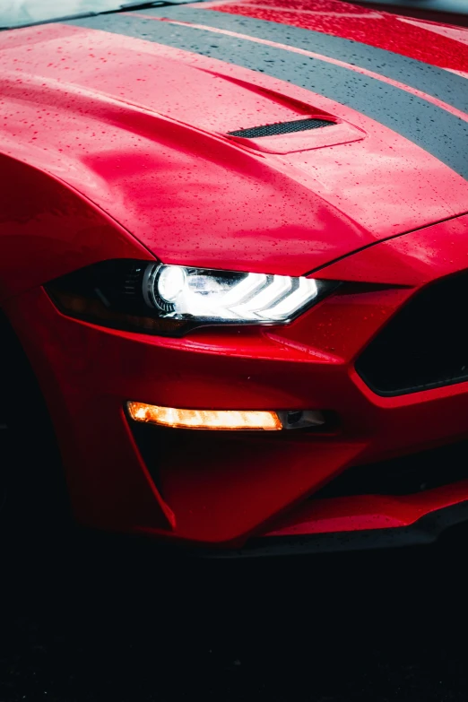 the front end of a red sports car