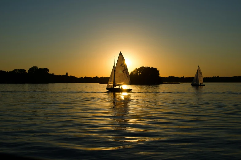 a couple of sail boats that are in the water