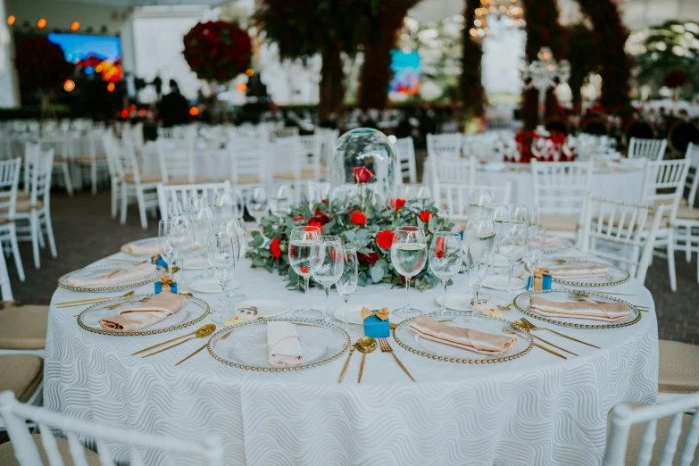 a white table covered in plates and cups