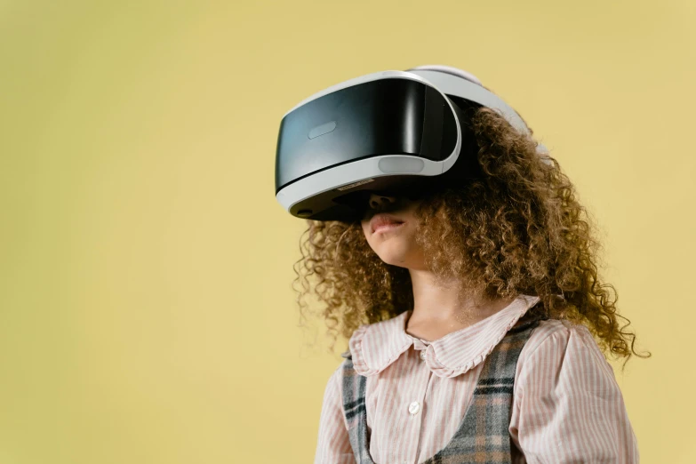 a child wearing a google cardboard virtual reality headset