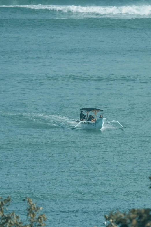 a small four wheel vehicle moving through the ocean