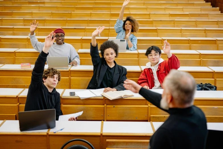 two men and two women applauding on lecture seats