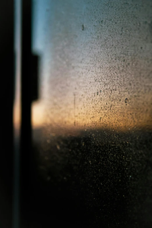 a window in a room that has rain droplets