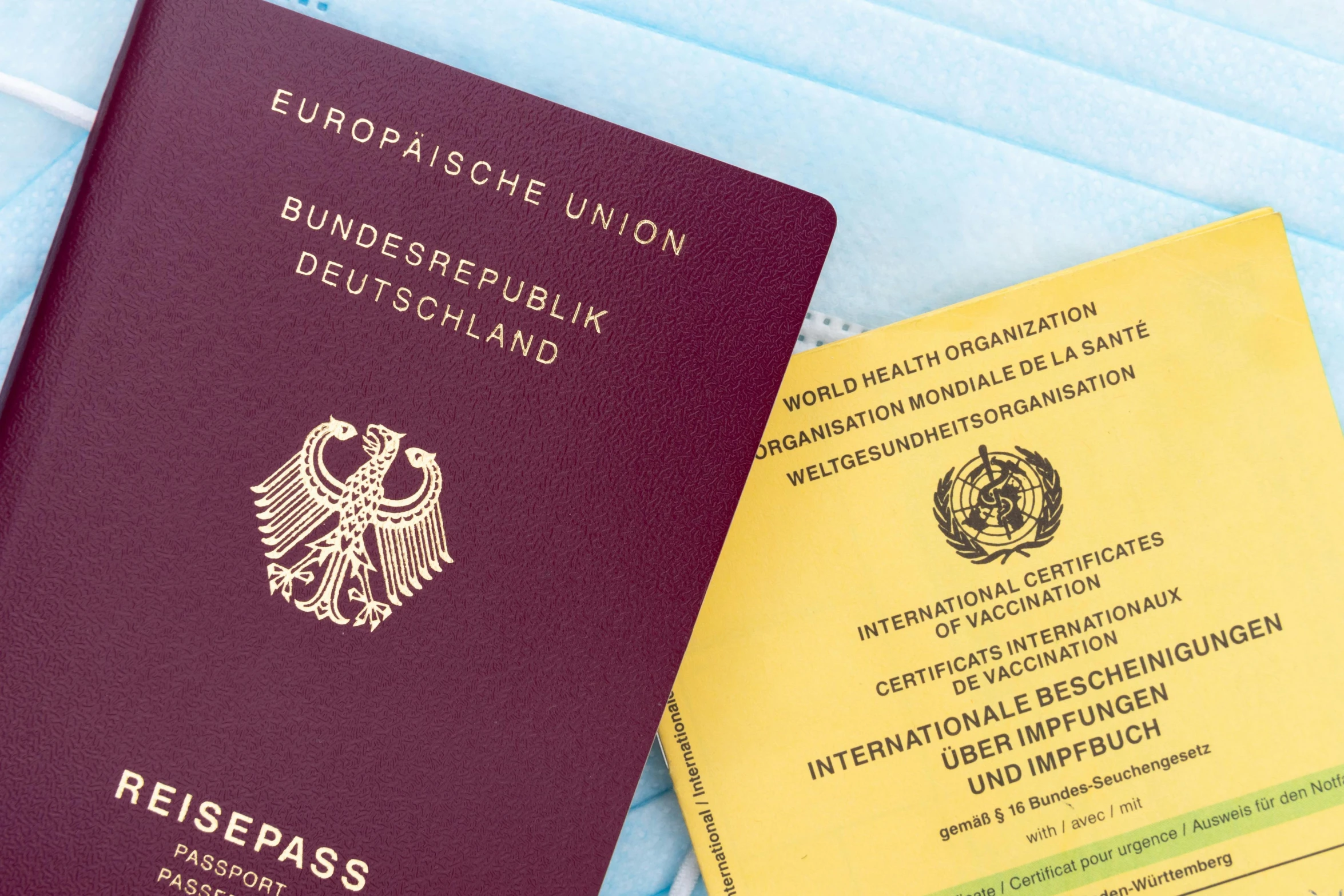 two passports sitting next to each other