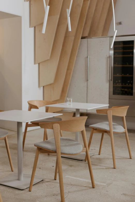 a kitchen with chairs, table and stove in it