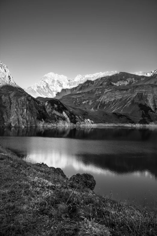 a couple of mountains that are next to a body of water