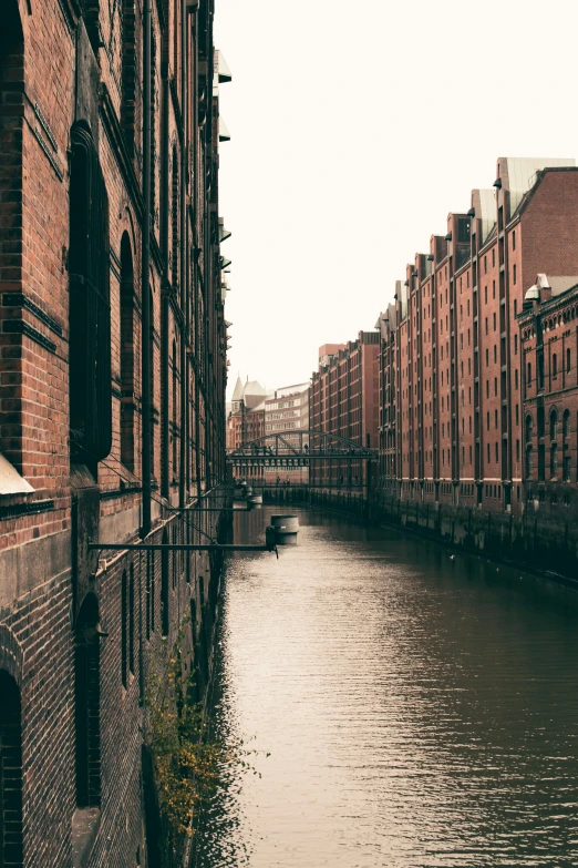 a city street with buildings along the river